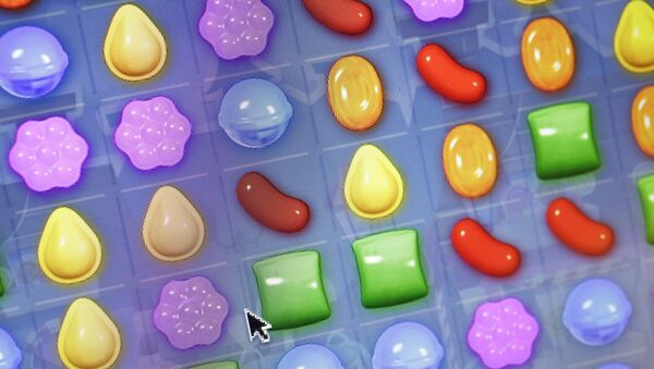 This Monday, March 24, 2014, file photo shows a detail from the online game Candy Crush Saga on a computer screen in New York. The mobile game Candy Crush Saga is coming to television - Sputnik International