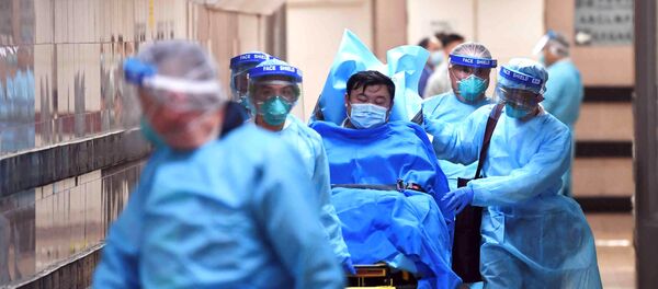 Medical staff transfer a patient of a highly suspected case of a new coronavirus at the Queen Elizabeth Hospital in Hong Kong, China January 22, 2020. Medical staff transfer a patient of a highly suspected case of a new coronavirus at the Queen Elizabeth Hospital in Hong Kong, China January 22, 2020. - Sputnik International
