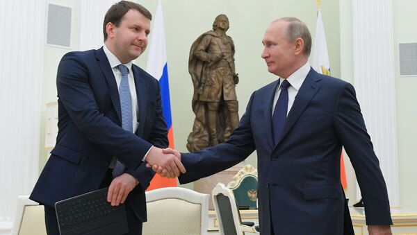 Russian President Vladimir and Economy Minister Maksim Oreshkin - Sputnik International
