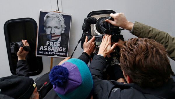 Photographers take pictures of WikiLeaks' founder Julian Assange as he leaves Westminster Magistrates Court in London, Britain January 13, 2020 - Sputnik International