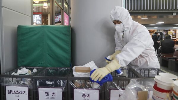 FILE - In this Jan. 24, 2020, file photo an employee works to prevent a new coronavirus at Suseo Station in Seoul, South Korea.  - Sputnik International