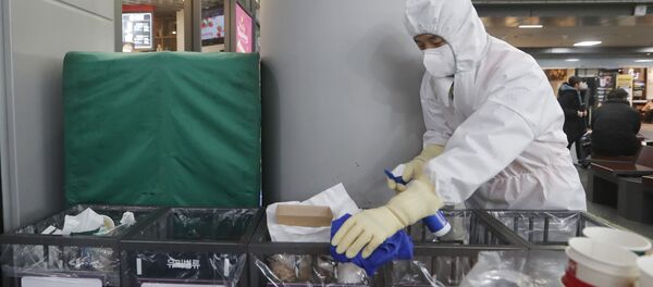 FILE - In this Jan. 24, 2020, file photo an employee works to prevent a new coronavirus at Suseo Station in Seoul, South Korea.  - Sputnik International
