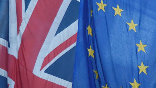 A Union flag flies next to the flag of the European Union in Westminster - Sputnik International