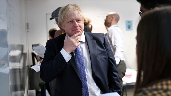 Britain's Prime Minister Boris Johnson reacts as he listens to students solving maths questions during his visit to the Department of Mathematics at King's Maths School, part of King's College London University, in central London, Britain, 27 January 2020 - Sputnik International