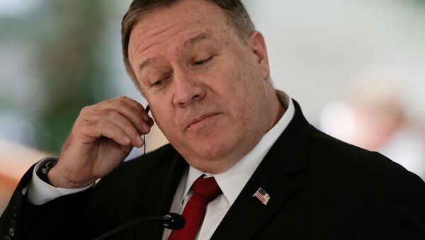 U.S. Secretary of State Mike Pompeo adjusts his earphone during a joint news conference with Costa Rica's President Carlos Alvarado (not pictured) at the Presidential house in San Jose, Costa Rica January 21, 2020 - Sputnik International