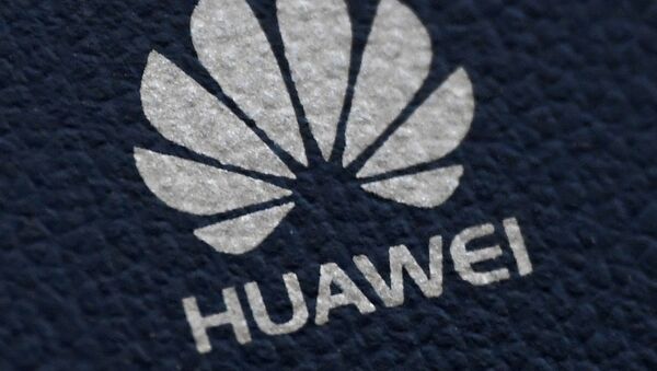 The Huawei logo is seen on a communications device in London, 28 January 2020 - Sputnik International
