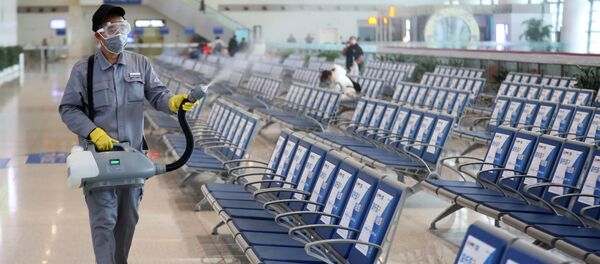Workers in protective mask disinfects a waiting hall following the outbreak of a new coronavirus at the Nanjing Railway Station, in Nanjing Workers in protective mask disinfects a waiting hall following the outbreak of a new coronavirus at the Nanjing Railway Station, in Nanjing - Sputnik International