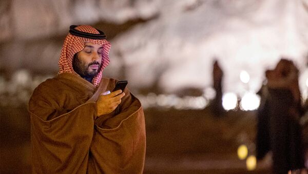 Saudi Arabia's Crown Prince Mohammed bin Salman uses his phone during a meeting with Japan's Prime Minister Shinzo Abe in Riyadh - Sputnik International