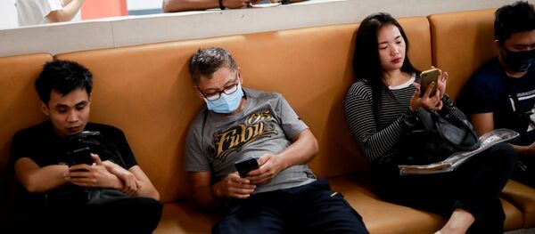 People wear masks at a transportation hub in Paranaque, Metro Manila, Philippines, January 30, 2020 - Sputnik International