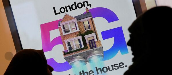 Pedestrians walk past an advertisement promoting the 5G data network at a mobile phone store in London, Britain, January 28, 2020. Pedestrians walk past an advertisement promoting the 5G data network at a mobile phone store in London, Britain, January 28, 2020. - Sputnik International