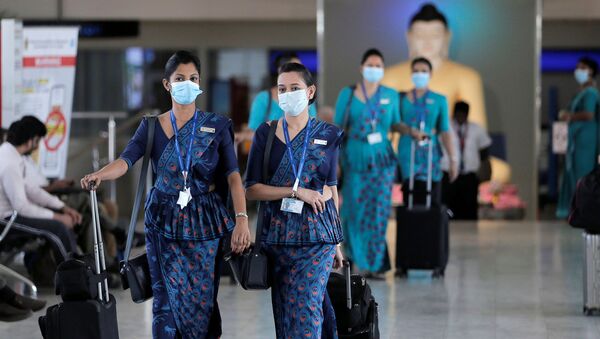 Sri Lankan Airlines staff wear masks at Bandaranaike International Airport after Sri Lanka confirmed the first case of coronavirus in the country, in Katunayake, Sri Lanka January 30, 2020. - Sputnik International