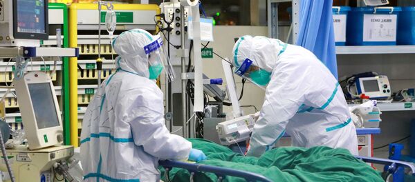 Medical staff in protective suits treat a patient with pneumonia caused by the new coronavirus at the Zhongnan Hospital of Wuhan Medical staff in protective suits treat a patient with pneumonia caused by the new coronavirus at the Zhongnan Hospital of Wuhan - Sputnik International
