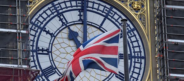 The British union flag is seen fluttering as the clock face of Big Ben shows eleven o'clock, London, January 30, 2020. - Sputnik International