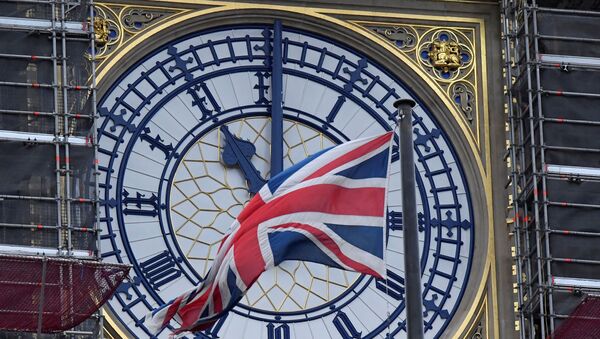 The British union flag is seen fluttering as the clock face of Big Ben shows eleven o'clock, London, January 30, 2020. - Sputnik International