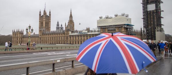 A woman walks near Houses of Parliament in London, Britain, January 30, 2020 A woman walks near Houses of Parliament in London, Britain, January 30, 2020 - Sputnik International