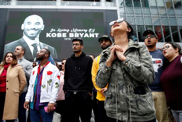 Mourners gather near an image of Kobe Bryant shown on a large screen outside the Staples Center after the retired Los Angeles Lakers basketball star was killed in a helicopter crash, in Los Angeles, California, U.S. January 26, 2020.  - Sputnik International