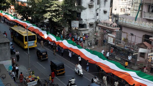 People hold an Indian national flag during a unity rally in Mumbai, India, January 24, 2020 - Sputnik International