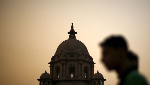 FILE PHOTO: A commuter walks past the building of India's Ministry of Finance during dusk in New Delhi, India, May 18, 2015.  - Sputnik International