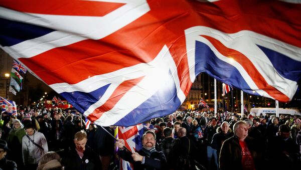 A man waves a British flag on Brexit day in London, Britain January 31, 2020 - Sputnik International