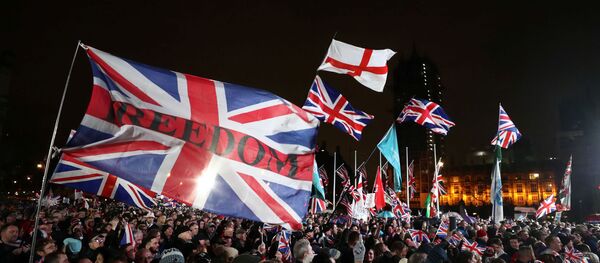 Pro-Brexit demonstrators celebrate on Parliament Square on Brexit day in London, Britain January 31, 2020. Pro-Brexit demonstrators celebrate on Parliament Square on Brexit day in London, Britain January 31, 2020. - Sputnik International