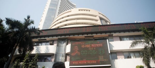 People walk past at a screen displaying India's Finance Minister Nirmala Sitharaman before the budget, on a facade of the Bombay Stock Exchange (BSE) building in Mumbai, India, February 1, 2020. People walk past at a screen displaying India's Finance Minister Nirmala Sitharaman before the budget, on a facade of the Bombay Stock Exchange (BSE) building in Mumbai, India, February 1, 2020. - Sputnik International
