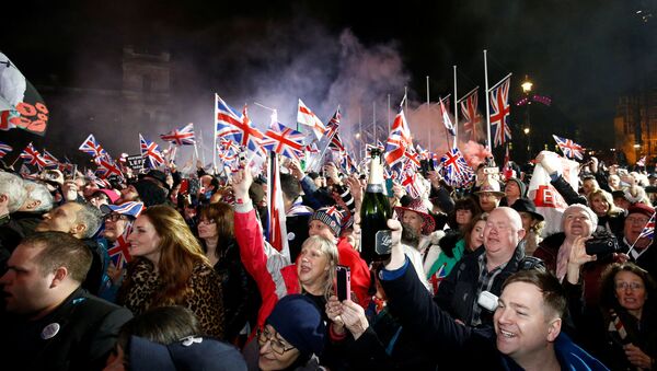 People wave flags as they celebrate Britain leaving the EU on Brexit day in London, Britain, January 31, 2020 - Sputnik International