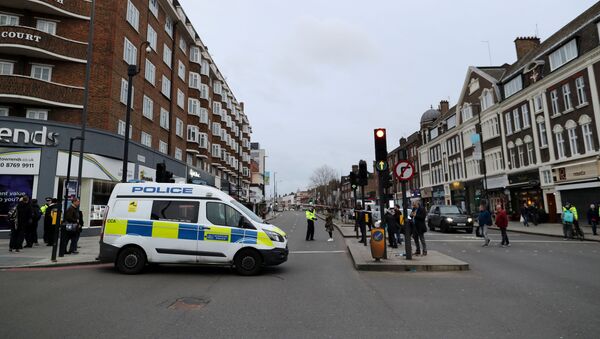 Police are seen near a site where a man was shot by armed officers in Streatham, south London, Britain, February 2, 2020 - Sputnik International
