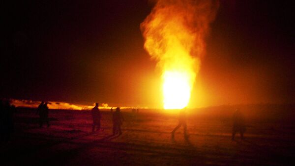 Flames shoot into the air after a gas pipeline explosion in the Sinai peninsula, 240 miles (374 kilometers) southeast of Cairo, Egypt, Sunday, Feb. 5, 2012 - Sputnik International