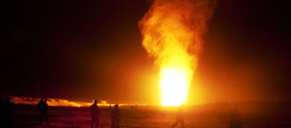 Flames shoot into the air after a gas pipeline explosion in the Sinai peninsula, 240 miles (374 kilometers) southeast of Cairo, Egypt, Sunday, Feb. 5, 2012 - Sputnik International