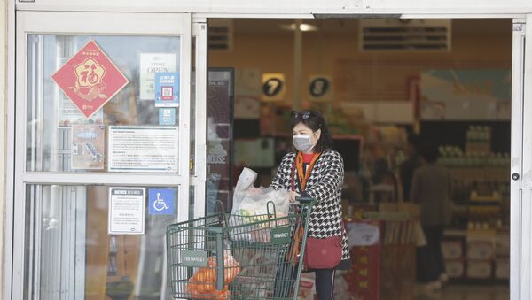 Customers wear protective masks as they shop at the 168 Market in Alhambra, Calif., Friday, Jan. 31, 2020. As China grapples with the growing coronavirus outbreak, Chinese people in the Los Angeles area, home to the third-largest Chinese immigrant population in the United States, are encountering a cultural disconnect as they brace for a possible spread of the virus in their adopted homeland.  - Sputnik International