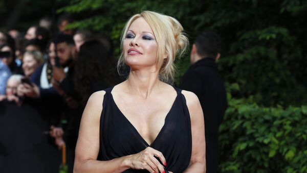 US actress Pamela Anderson arrives with Soccer player Adil Rami at the UNFP (Union of French Professional Footballers) ceremony, in Paris, France, Sunday, May 19, 2019. - Sputnik International