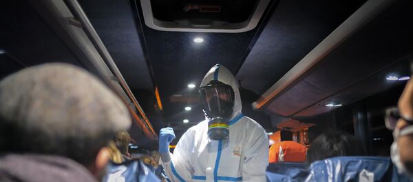 Evacuees from Wuhan, China after their arrival at a military base in Wroclaw, Poland Evacuees from Wuhan, China after their arrival at a military base in Wroclaw, Poland - Sputnik International