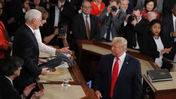 President Donald Trump turns after handing copies of his speech to House Speaker Nancy Pelosi of Calif., and Vice President Mike Pence as he delivers his State of the Union address to a joint session of Congress on Capitol Hill in Washington, Tuesday, Feb. 4, 2020. - Sputnik International
