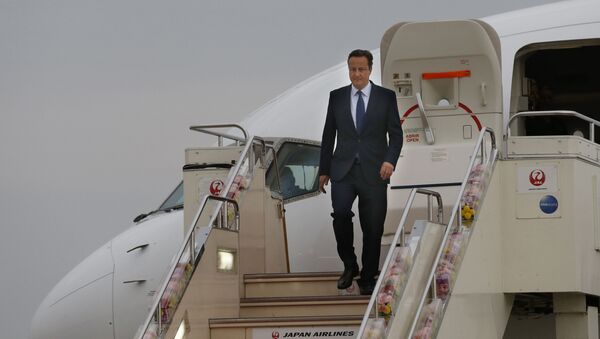 Britain's Prime Minister David Cameron walks down the steps of a plane upon his arrival at Chubu Centrair International Airport in Tokoname, Aichi Prefecture, Japan, for the Group of Seven summit, Wednesday, May 25, 2016 - Sputnik International