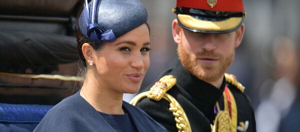In this file photo taken on June 08, 2019 Britain's Meghan, Duchess of Sussex (L) and Britain's Prince Harry, Duke of Sussex (R) return to Buckingham Palace after the Queen's Birthday Parade, 'Trooping the Colour', in London - Sputnik International