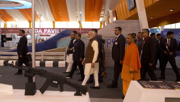 Indian Prime Minister Narendra Modi, center, and Chief Minister of Uttar Pradesh state Yogi Adityanath, in saffron, attend the DefExpo in Lucknow, India, Wednesday, Feb. 5, 2020 - Sputnik International