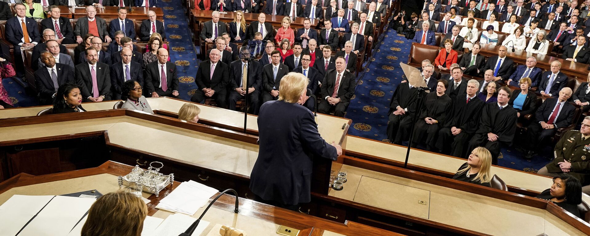 President Donald Trump delivers his State of the Union address to a joint session of Congress on Capitol Hill in Washington, Tuesday, Feb. 4, 2020, as House Speaker Nancy Pelosi of Calif., left, watches. - Sputnik International, 1920, 07.08.2022