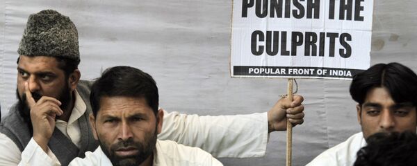 Indian Muslim activists of Popular Front of India sit at a protest in New Delhi, India, Tuesday, Dec. 6, 2011 to mark the anniversary of the Babri mosque demolition - Sputnik International