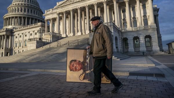 Anti-Trump activist Stephen Parlato of Boulder, Colo., arrives at the Capitol in Washington, early Friday, Jan. 31, 2020, as the Senate resumes the impeachment trial of President Donald Trump on charges of abuse of power and obstruction of Congress. - Sputnik International