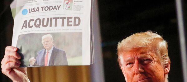 U.S. President Donald Trump holds up a copy of USA Today's front page showing news of his acquitttal in his Senate impeachment trial, as he arrives to address the National Prayer Breakfast in Washington, U.S., 6 February, 2020. U.S. President Donald Trump holds up a copy of USA Today's front page showing news of his acquitttal in his Senate impeachment trial, as he arrives to address the National Prayer Breakfast in Washington, U.S., 6 February, 2020. - Sputnik International