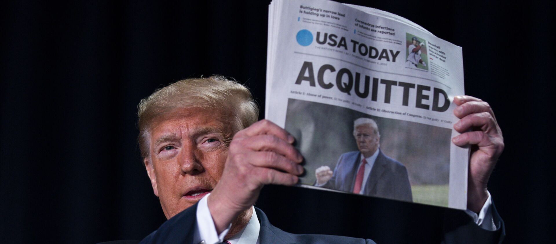 President Donald Trump holds up a newspaper with the headline that reads ACQUITTED at the 68th annual National Prayer Breakfast, at the Washington Hilton, Thursday, Feb. 6, 2020, in Washington. - Sputnik International, 1920, 20.01.2021