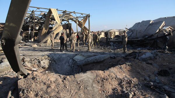 In this Monday, Jan. 13, 2020 photo, U.S. Soldiers stand at spot hit by Iranian bombing at Ain al-Asad air base, in Anbar, Iraq - Sputnik International