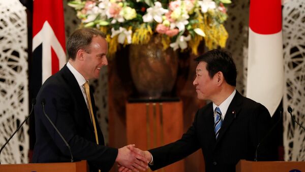 British Foreign Secretary Dominic Raab and Japanese Foreign Minister Toshimitsu Motegi attend their joint news conference after their meeting in Tokyo, Japan February 8, 2020. - Sputnik International