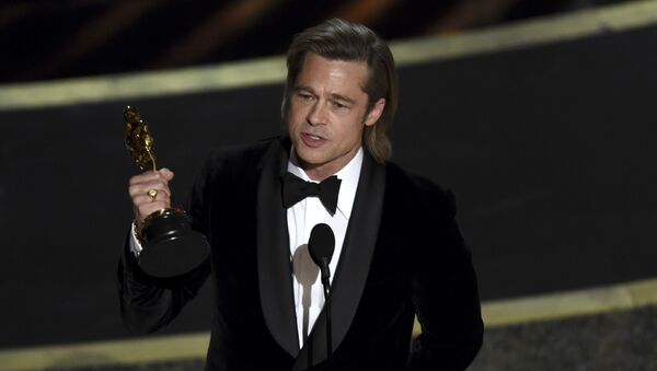 Brad Pitt accepts the award for best performance by an actor in a supporting role for Once Upon a Time in Hollywood at the Oscars on Sunday, Feb. 9, 2020, at the Dolby Theatre in Los Angeles. - Sputnik International