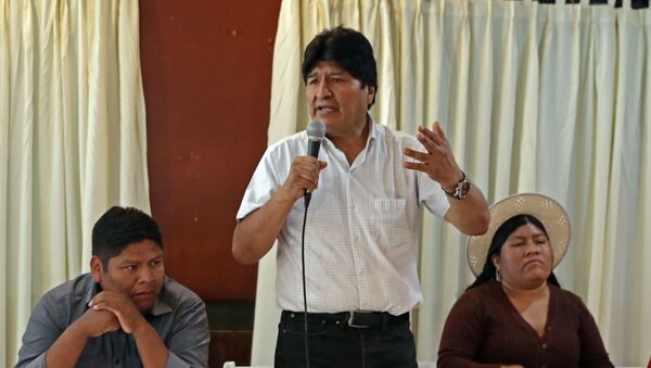 Bolivian ex-president Evo Morales (C), exiled in Argentina, speaks flanked by members of his Movimiento al Socialismo - Movement for Socialism - (MAS) party - Sputnik International