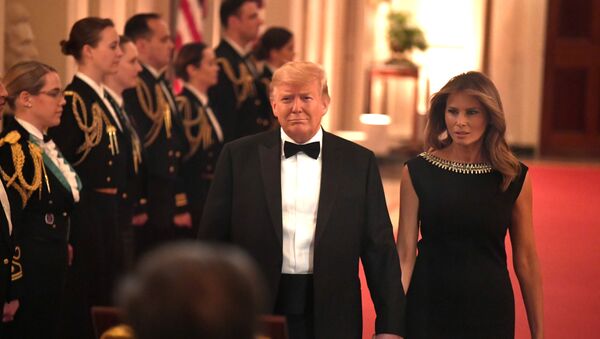 U. S. President Donald Trump holds hands with first lady Melania Trump as they arrive to host the Governors Ball in the East Room of the White House, Washington, DC, U.S., February 9, 2020 - Sputnik International