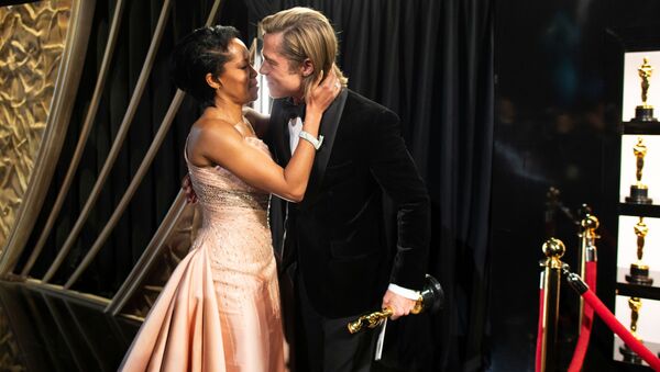Best Supporting Actor Brad Pitt embraces Regina King as he holds his Oscar at the 92nd Academy Awards in Hollywood, Los Angeles, California on 9 February 2020.  - Sputnik International