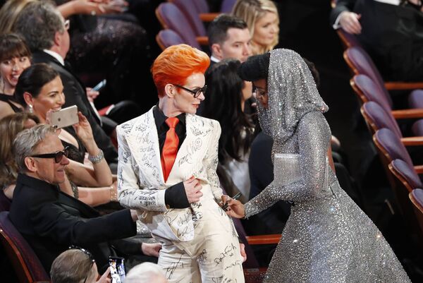 Janelle Monae signs Sandy Powell's outfit during the Oscars show at the 92nd Academy Awards in Hollywood, Los Angeles, California on 9 February 2020.  - Sputnik International