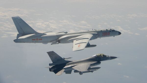 An H-6 bomber of Chinese PLA Air Force flies near a Taiwan F-16 in this February 10, 2020 handout photo provided by Taiwan Ministry of National Defense. - Sputnik International