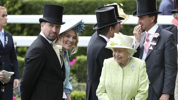 Britain's Queen Elizabeth II right talks to her grandson, Peter Phillips, left and his wife Autumn, during day five of Royal Ascot in Ascot, England, Saturday June 22, 2019 - Sputnik International